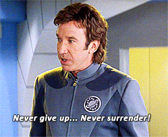 Galaxy Quest GIF that says "never give up, never surrender"
